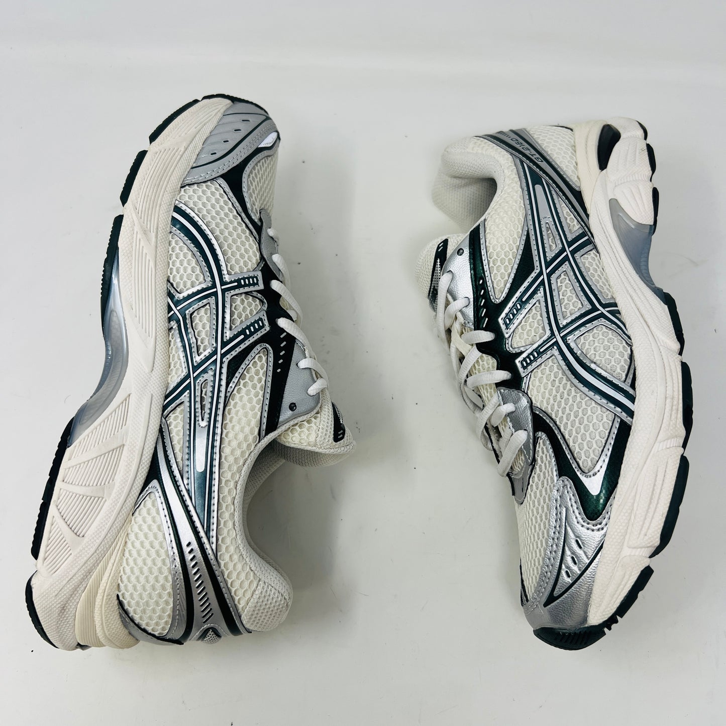 An ASICS GT-2160 Kith Cream Scarab (2023) running shoe with a clean cream and scarab-colored mesh design featuring black accents sits on a brown box. Priced at $350, the box in good condition details sizing and brand logos.