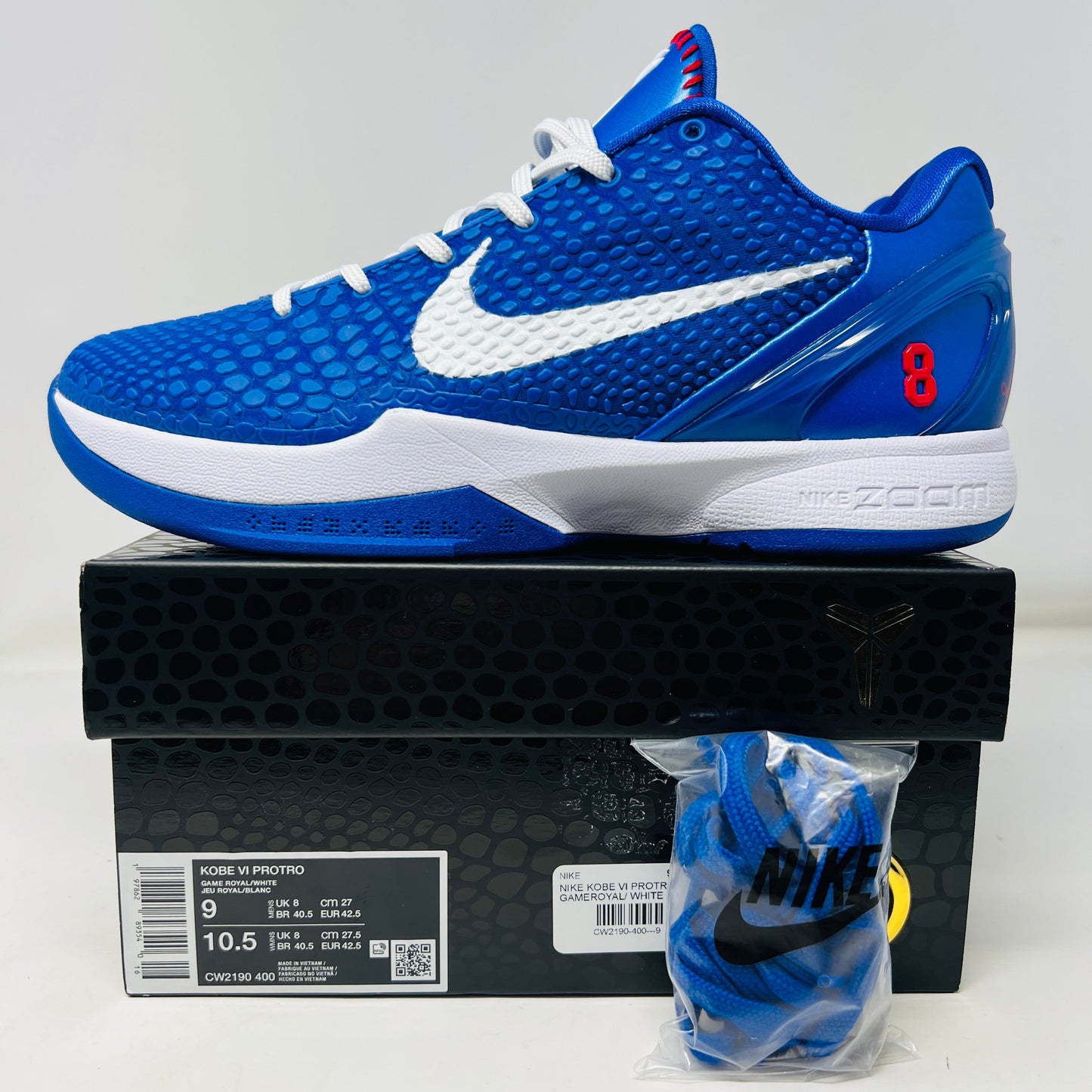Nike Kobe 6 Protro Dodgers sneaker with blue upper, white swoosh, red accents, and included blue laces, box in good condition.