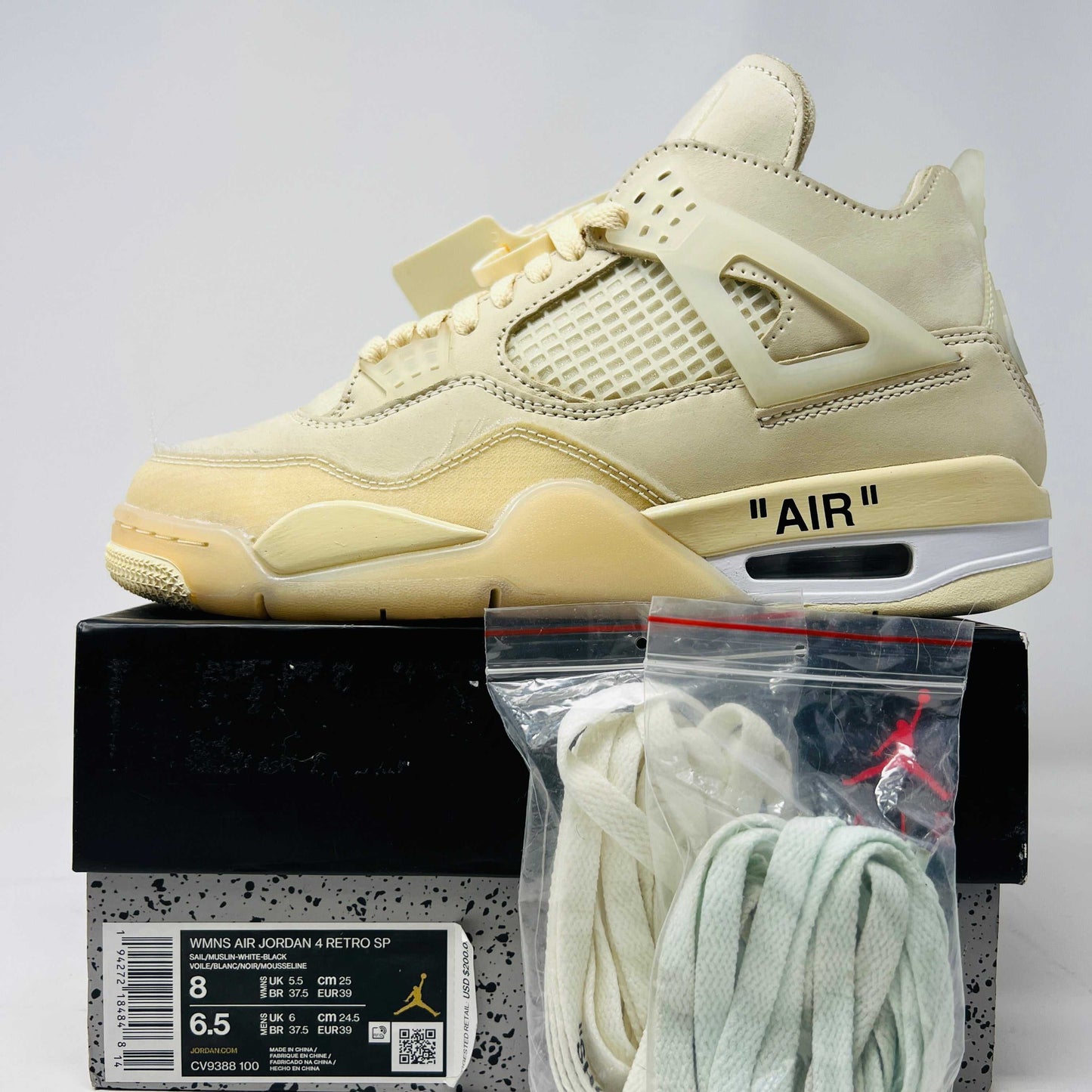Jordan 4 Retro Off-White Sail Women's sneakers with extra laces, size 8W/6.5M, slightly worn, 2020 release.