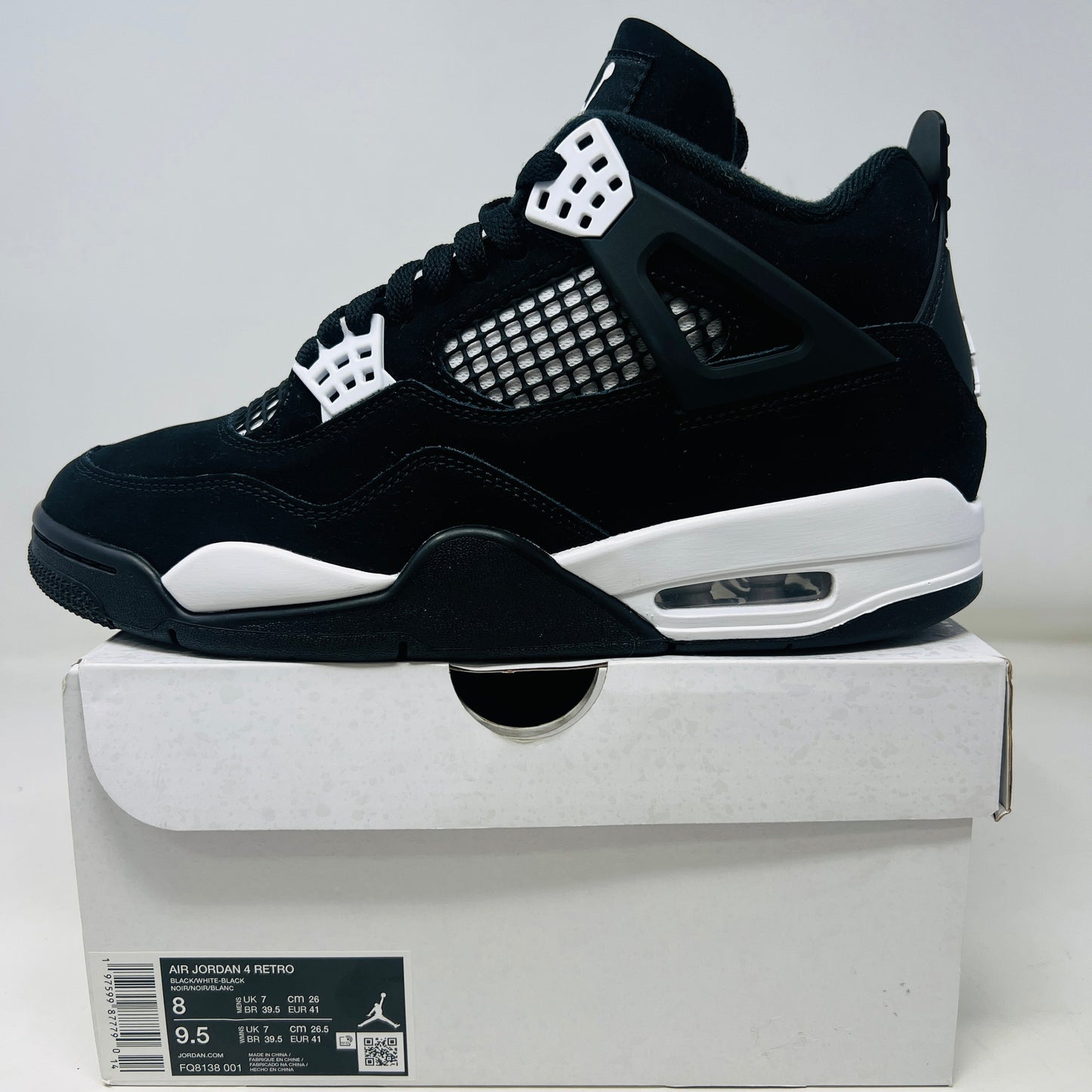 Jordan 4 Retro White Thunder sneakers, lightly worn, 2024 edition.