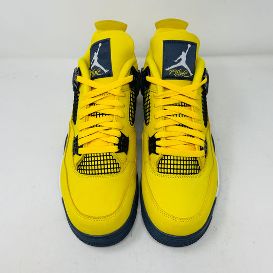 Jordan 4 Lightning sneakers with bold yellow and black colorway.