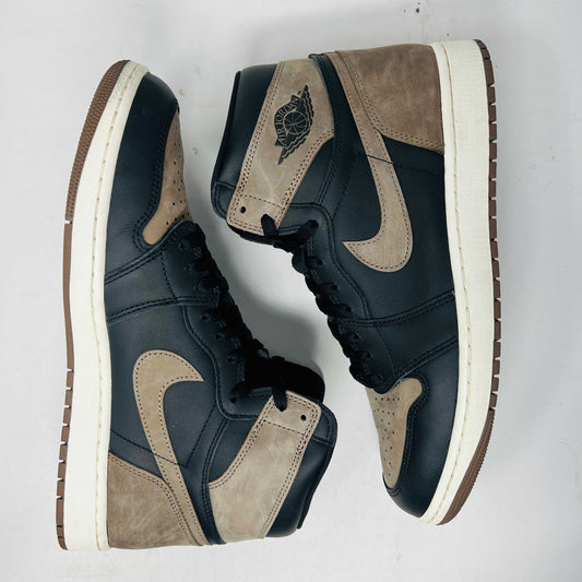 Pre-owned Air Jordan 1 sneakers in black and brown with white midsoles, popular for style and resale value.