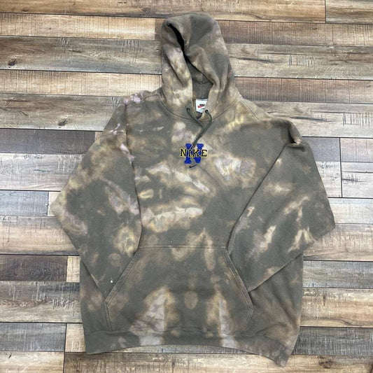 Nike Logo Center Swoosh Hoodie, preowned, tie-dye style, on wooden floor.