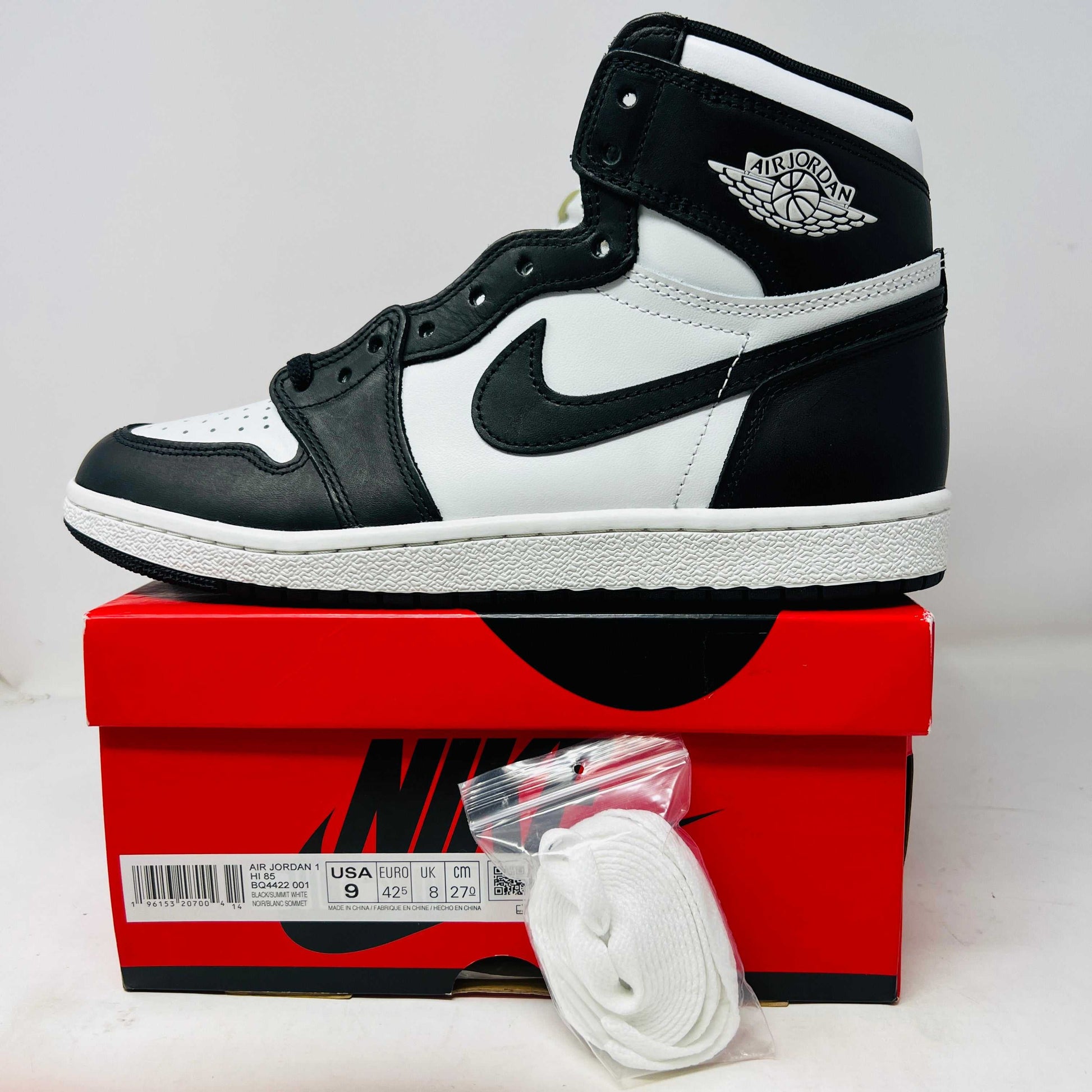Jordan 1 Retro High '85 Black White 2023 with extra laces on box.