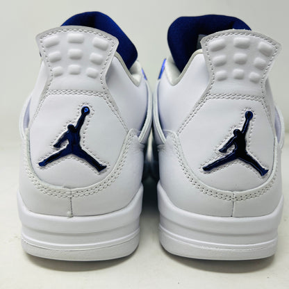 The Jordan 4 Retro Metallic Purple sneaker features white material with blue mesh accents, a visible air cushion in the heel, textured sole, angular overlays, and a padded collar. Note: no box included.