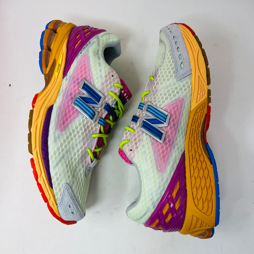 The New Balance 1906R Action Bronson Rosewater sneakers feature white mesh uppers, pink tongues with Baklava, neon green laces, blue accents, and orange midsoles. In BRAND NEW condition, theyre straight from the box.