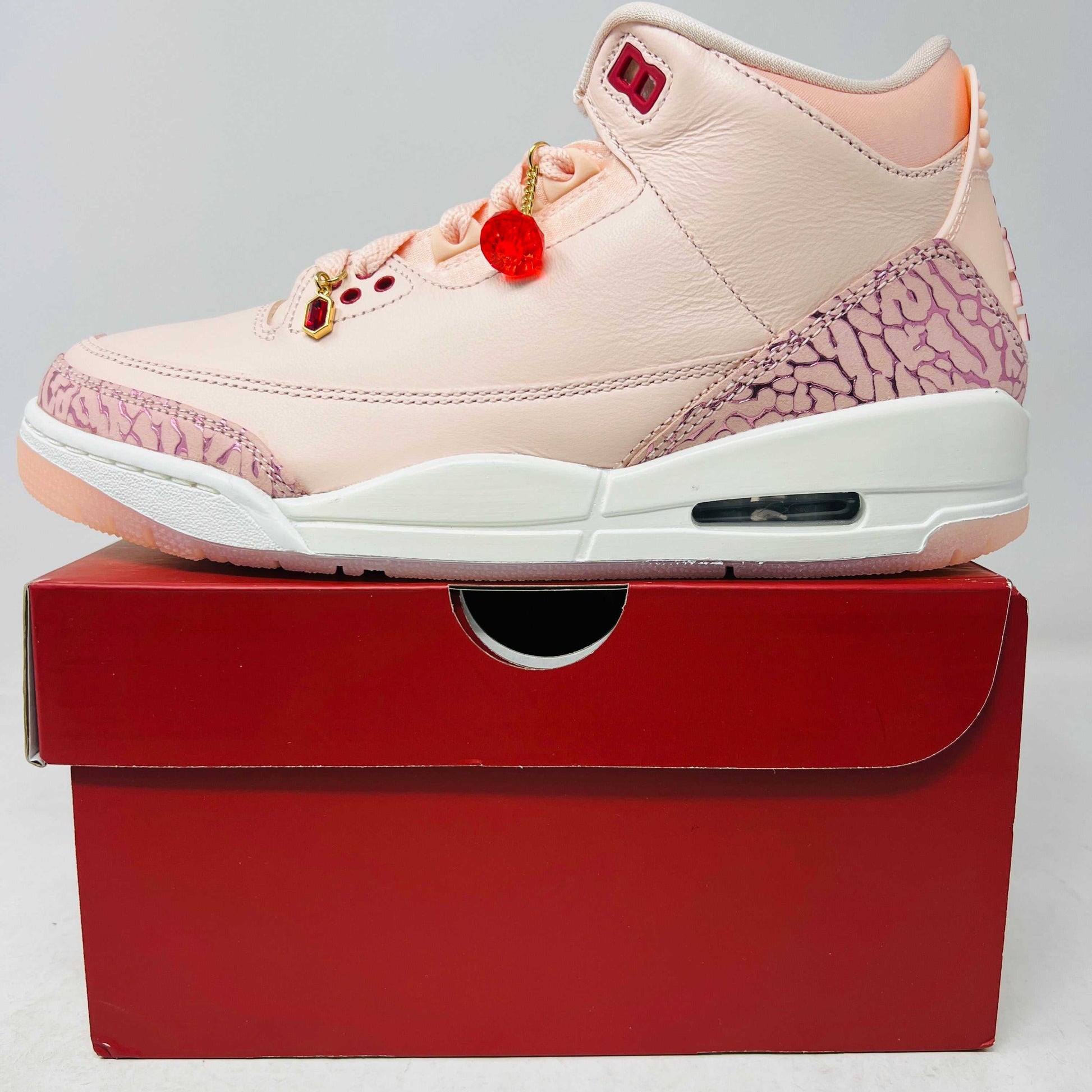 Jordan 3 Retro Valentine's Day 2025 women's sneakers in pastel pink with red accents, brand new condition, featuring gem accessories.