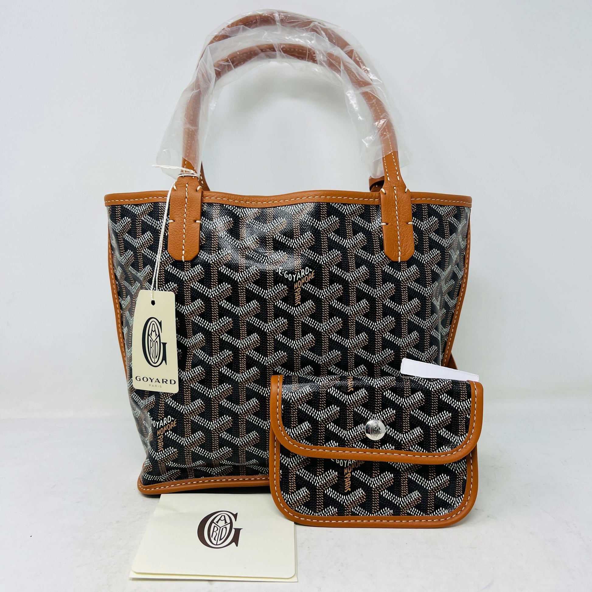 Goyard Anjou Mini Bag in black and tan, brand new condition, with pouch and tag.
