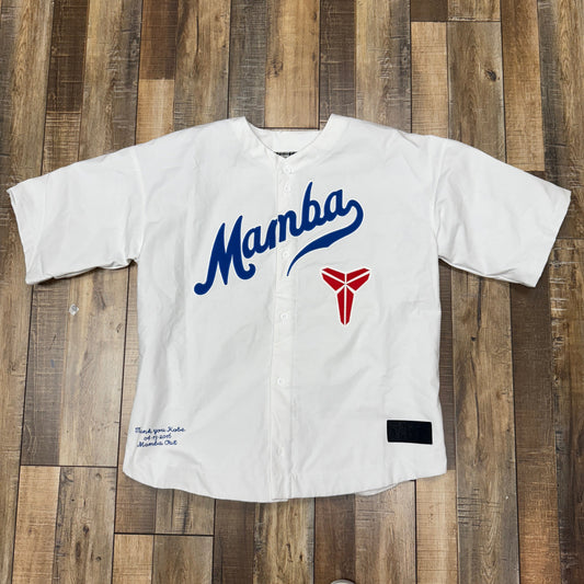 White and blue Nike Kobe Bryant baseball top featuring "Mamba" text.
