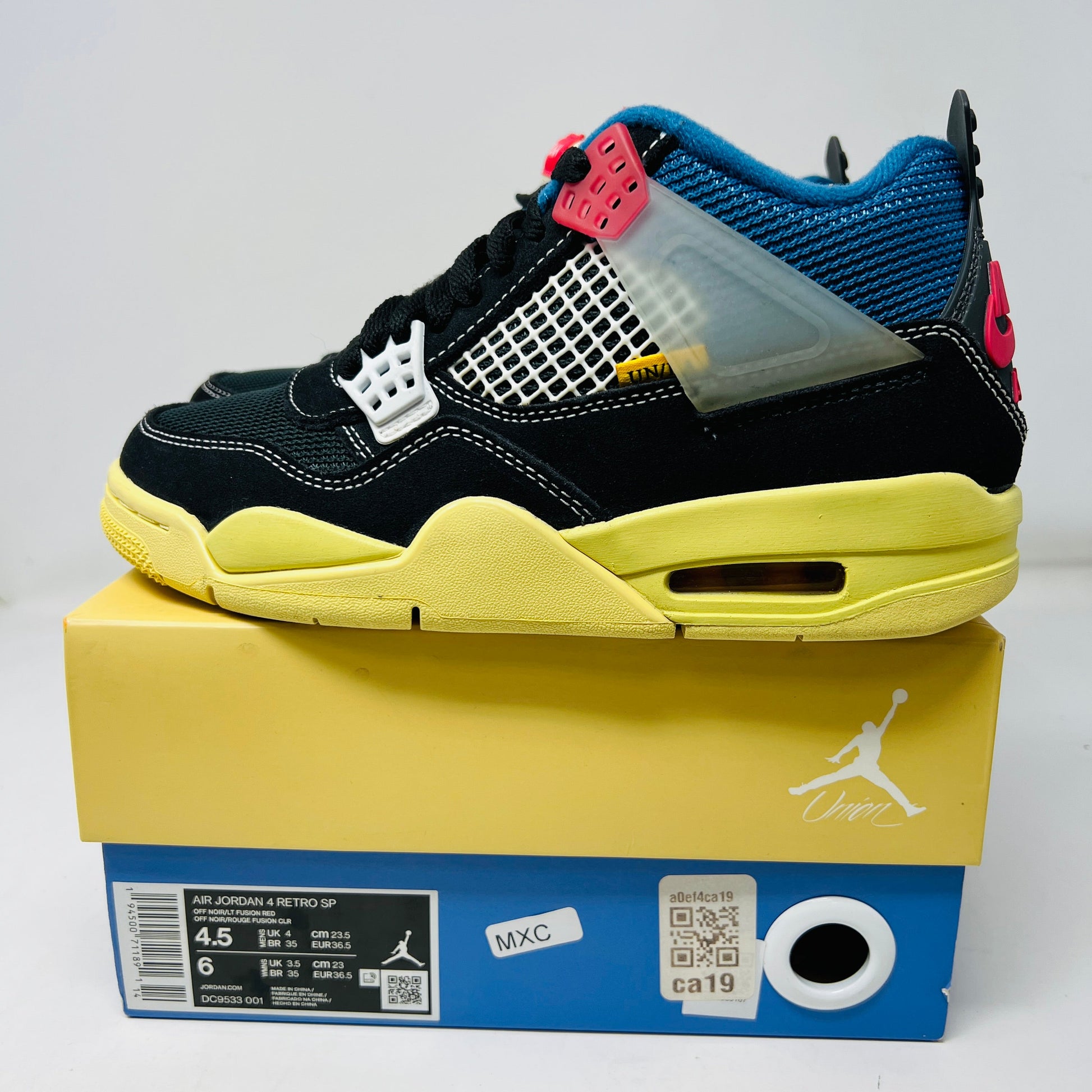 The Jordan 4 Retro Union Off Noir sneakers, featuring black color with yellow soles and red accents, come in a pristine yellow and blue box. The box includes a size label, QR code, and the white Jumpman logo, along with extra laces for convenience.