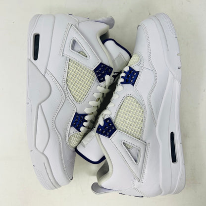 The Jordan 4 Retro Metallic Purple sneaker features white material with blue mesh accents, a visible air cushion in the heel, textured sole, angular overlays, and a padded collar. Note: no box included.