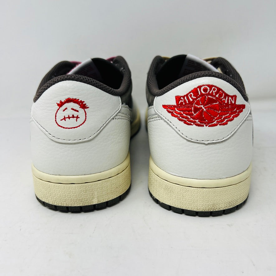 A pair of 2022 Jordan 1 Retro Low OG SP Travis Scott Reverse Mocha sneakers arranged side by side features beige laces on the left and pink on the right. Both have dark brown toe caps with clean white and brown detailing, showing minimal wear.