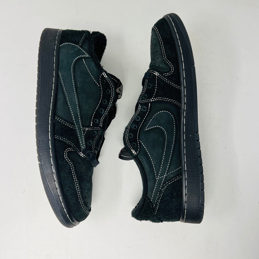 The Jordan 1 Retro Low OG SP Travis Scott Black Phantom sneaker, featured on a Nike box, flaunts black suede with a clean upper and white swoosh. Size info: US 9.5, Euro 43, UK 8.5, CM 27.5—ideal for general wear due to its visible stitching design.
