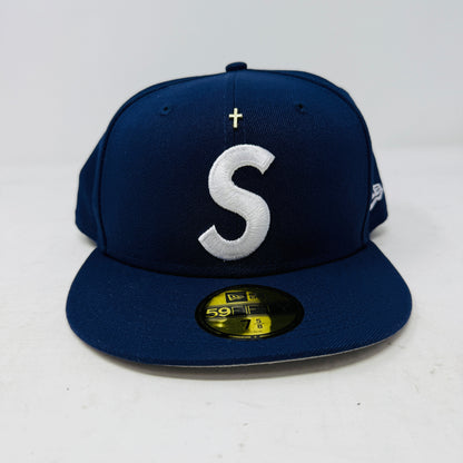 Light navy Supreme fitted hat with gold cross and white S logo front