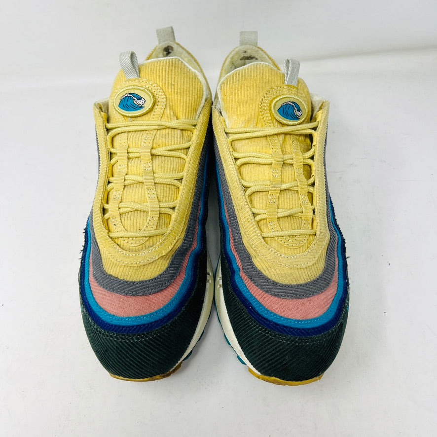 The Nike Air Max 1/97 Sean Wotherspoon sneakers showcase a colorful upper with hues of yellow, blue, and pink. They include extra blue and white laces and come in a red box labeled with size 9.5.