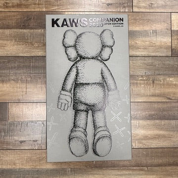 Brand new Kaws Companion figure standing on white background