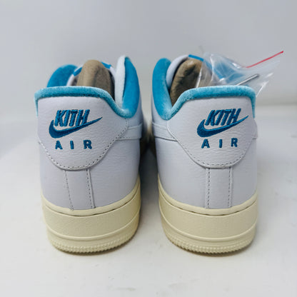 Introducing the Nike Air Force 1 Low Kith Hawaii sneaker: a fresh white design with white laces, light blue inner lining, teal swoosh, textured pattern, and cream-colored sole. Packaged in a gray shoebox, it features the word AIR embossed on the side.