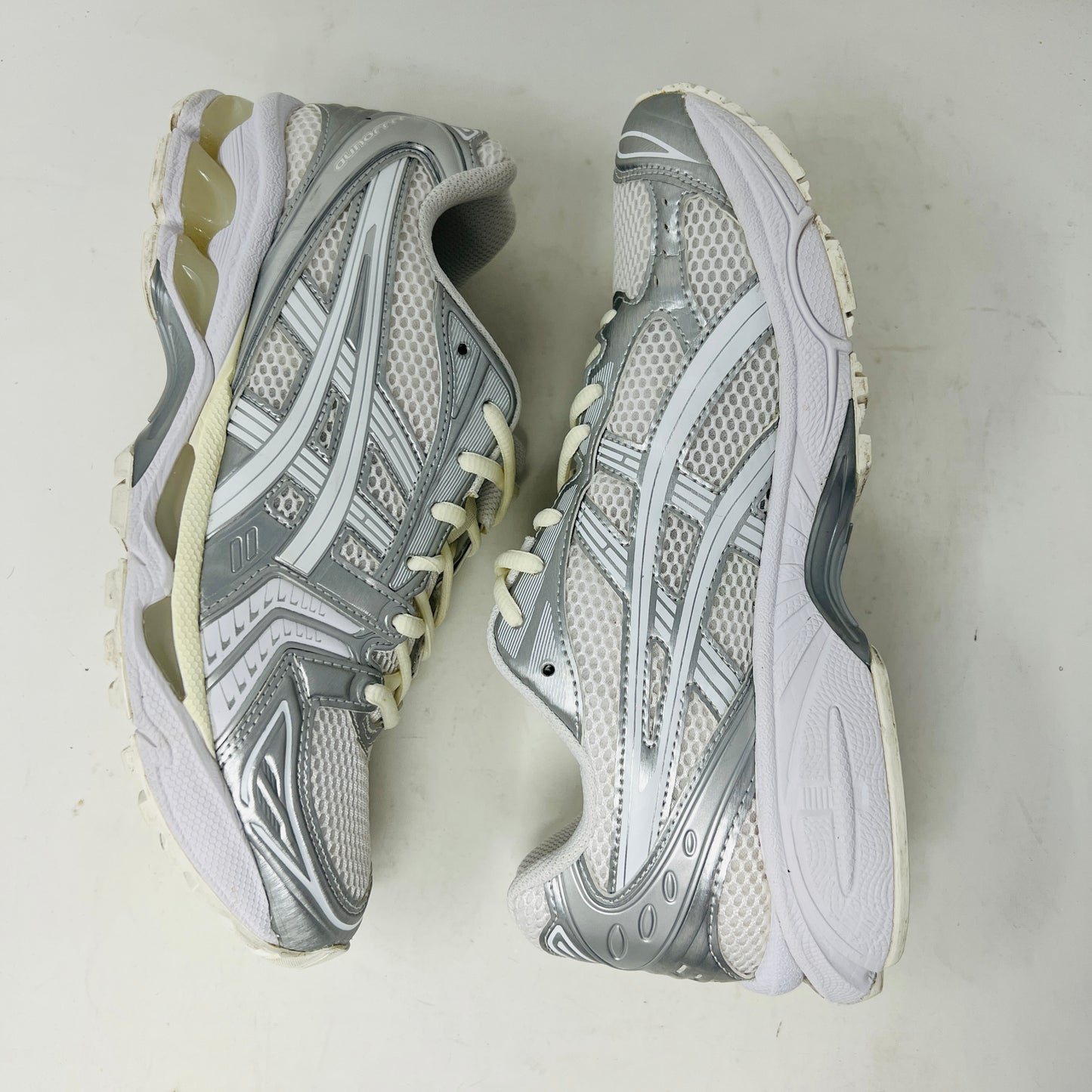 ASICS Gel-Kayano 14 JJJJound Silver White sneaker with clean upper, light wear, in 2021 edition; includes extra laces, on box.
