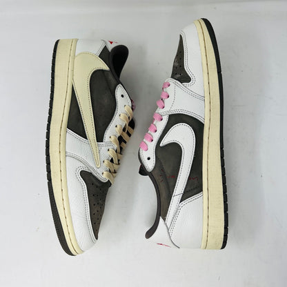 A pair of 2022 Jordan 1 Retro Low OG SP Travis Scott Reverse Mocha sneakers arranged side by side features beige laces on the left and pink on the right. Both have dark brown toe caps with clean white and brown detailing, showing minimal wear.