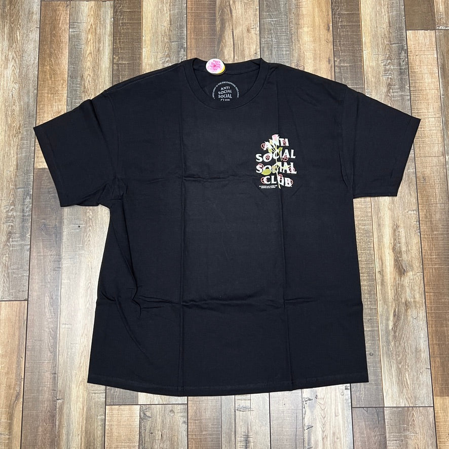 Black Anti Social Social Club x Sadboyz Pink Rose Tee on wooden floor.
