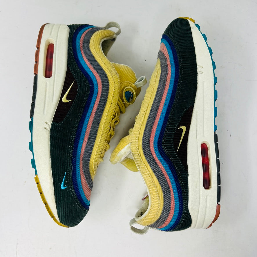 The Nike Air Max 1/97 Sean Wotherspoon sneakers showcase a colorful upper with hues of yellow, blue, and pink. They include extra blue and white laces and come in a red box labeled with size 9.5.