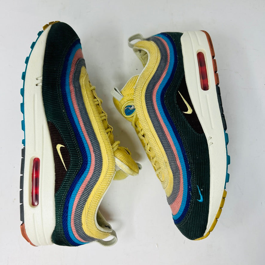 The Nike Air Max 1/97 Sean Wotherspoon sneakers showcase a colorful upper with hues of yellow, blue, and pink. They include extra blue and white laces and come in a red box labeled with size 9.5.