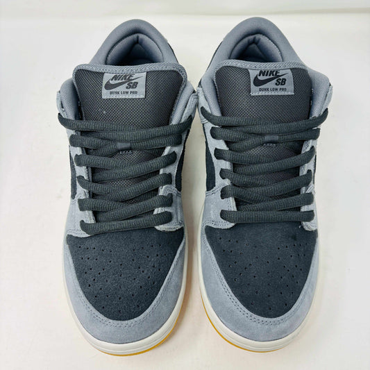 Introducing the Nike SB Dunk Low Dark Smoke Grey sneakers, featuring a gray and black design with a mustard sole. Packaged in a signature purple box with extra black laces, these 100% authentic sneakers ensure your style stays fresh and versatile.