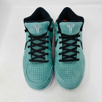 Green Nike Kobe 4 Protro Girl Dad basketball shoe with a black swoosh, silver heel accent, and suede finish sits atop a Nike shoebox. In 9/10 condition and worn once, the label indicates size 9.5 US with additional sizing details for these authentic shoes.