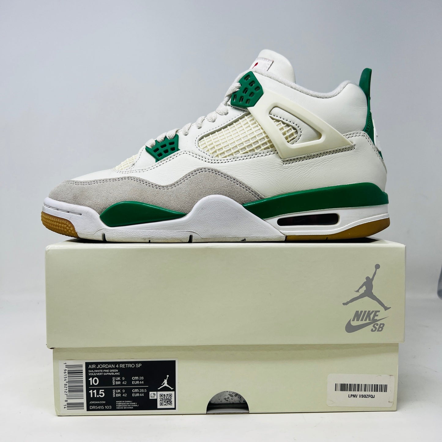 Jordan 4 Retro SB Pine Green sneakers with slight heel drag, 2023 model, on original box.