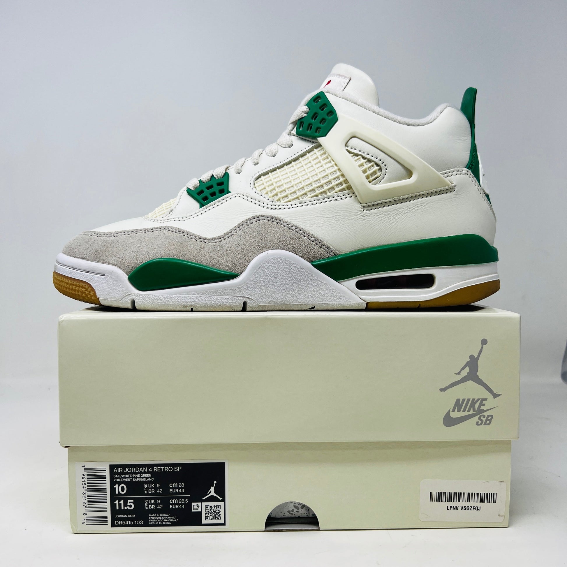Jordan 4 Retro SB Pine Green sneakers with slight heel drag, 2023 model, on original box.