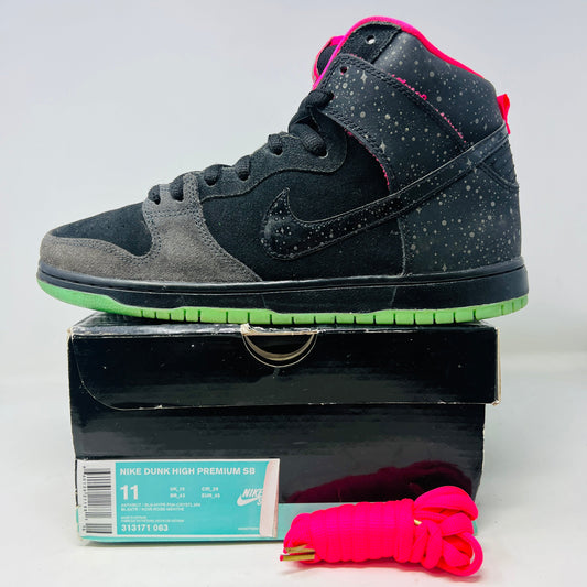 Nike SB Dunk High Premier Northern Lights sneaker with extra laces, showing slightly worn uppers and heel drag, on a warped box.