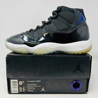 Jordan 11 Retro Space Jam 2016 sneakers with slight yellowing on soles, ripped sleeve box.