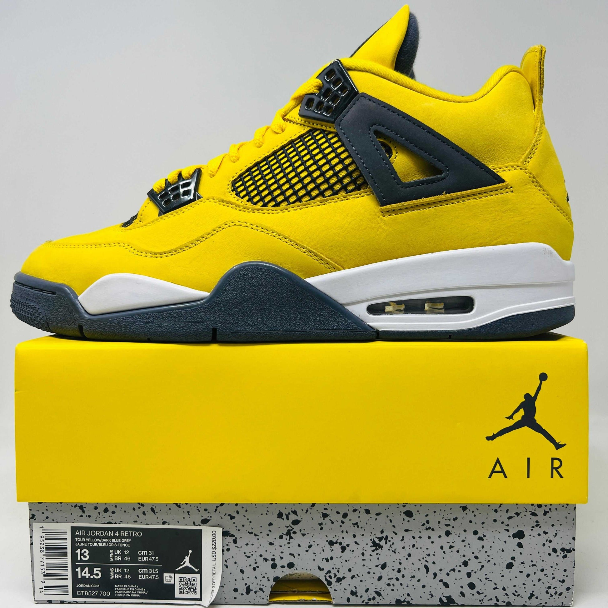 Jordan 4 Retro Lightning (2021) sneakers in yellow and black, displayed on shoe box.
