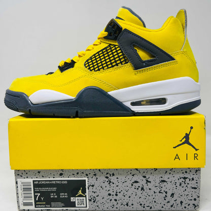 Jordan 4 Retro Lightning (2021) (GS) sneakers in yellow and black, condition 8.5/10.
