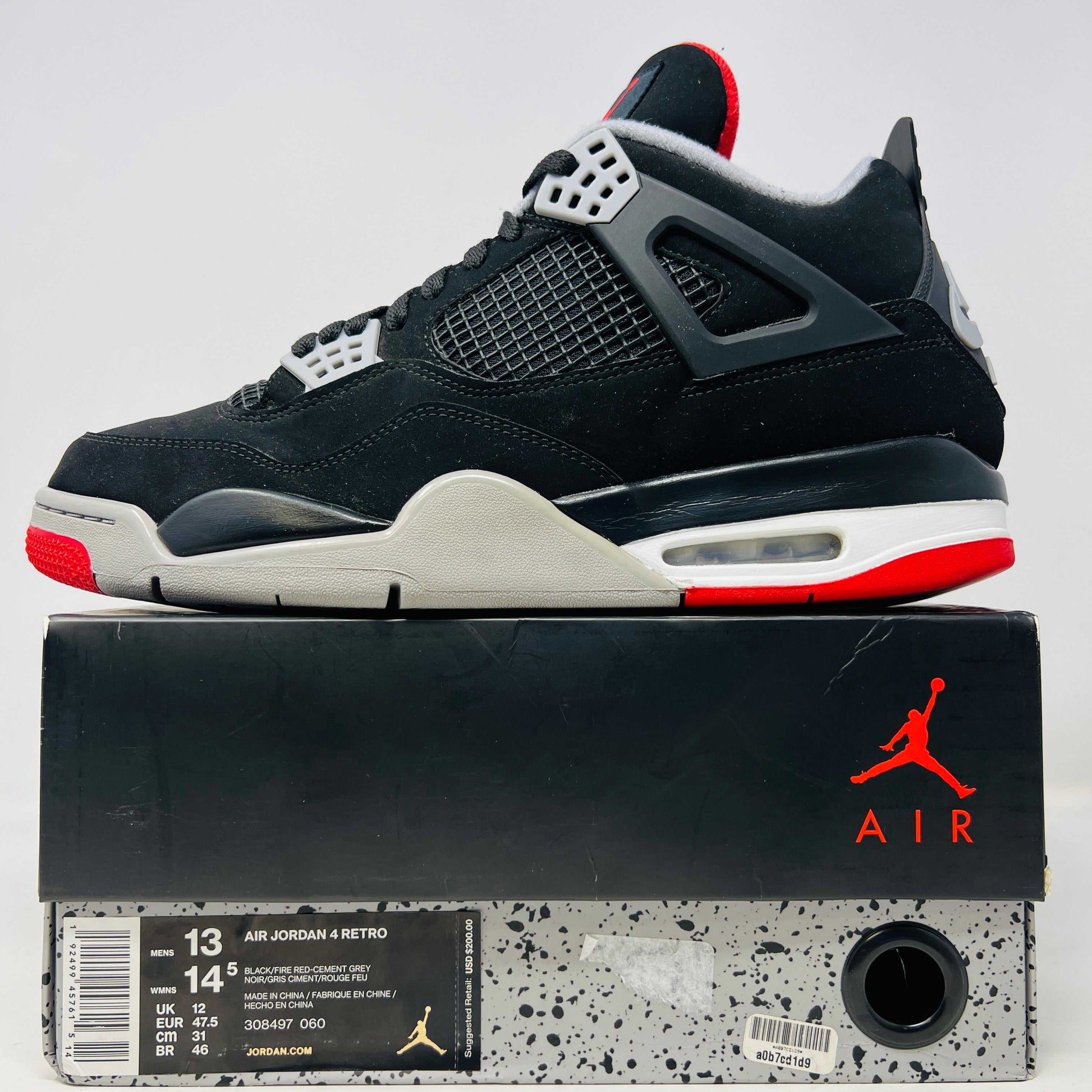 Jordan 4 Retro Bred (2019) sneakers, black and red colorway, displayed on original box.