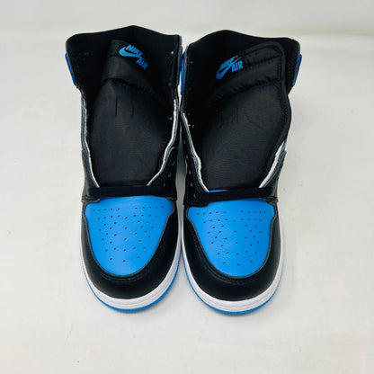 A pair of 100% authentic Jordan 1 Retro High OG UNC Toe (GS) sneakers in black, white, and blue sits on a matching blue box. The shoes feature the iconic black Nike swoosh logo on the side.