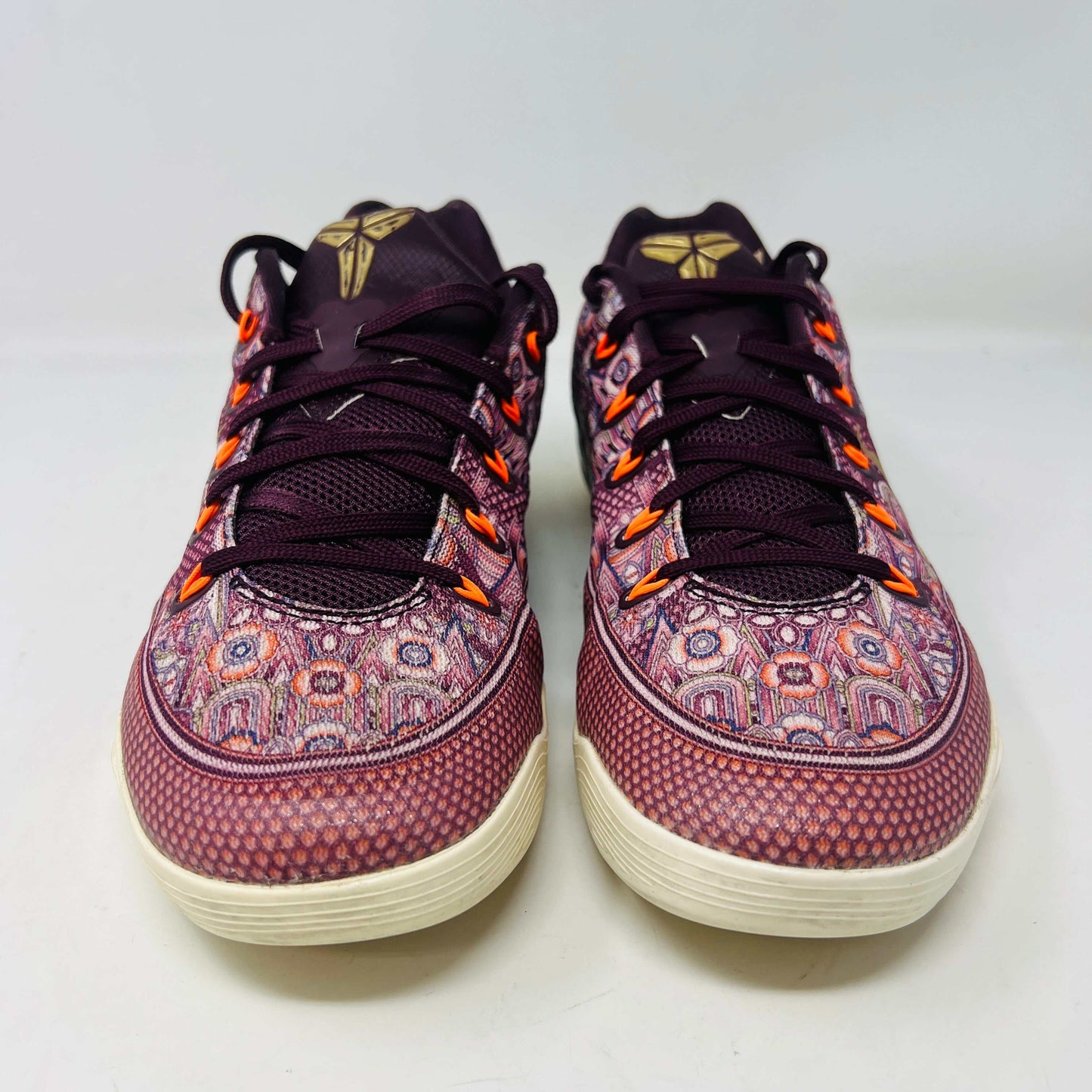 Nike Kobe 9 EM Low Silk sneakers in used condition with slight yellowing and wear.