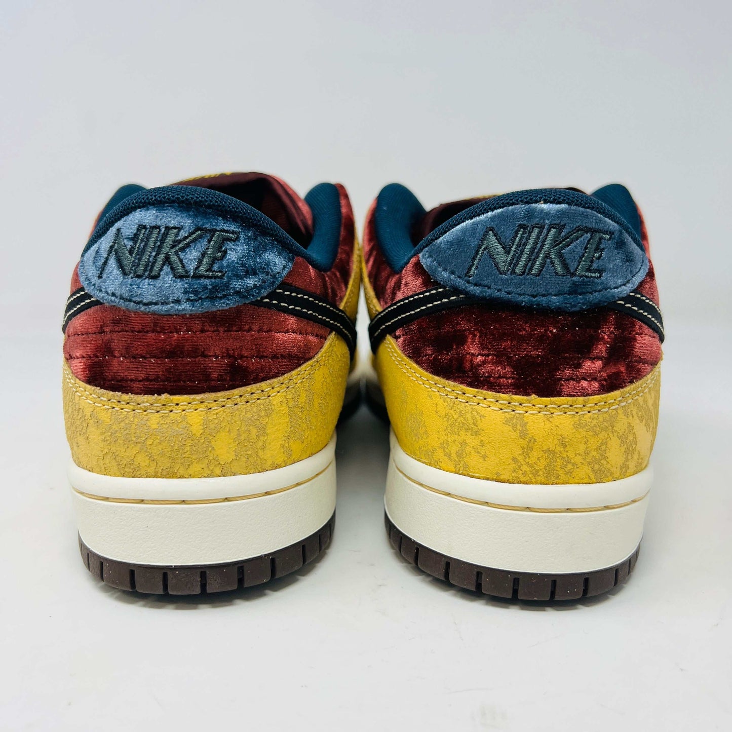 Nike SB Dunk Low City of Cinema sneakers, brand new, rear view showcasing velvet and textured design.