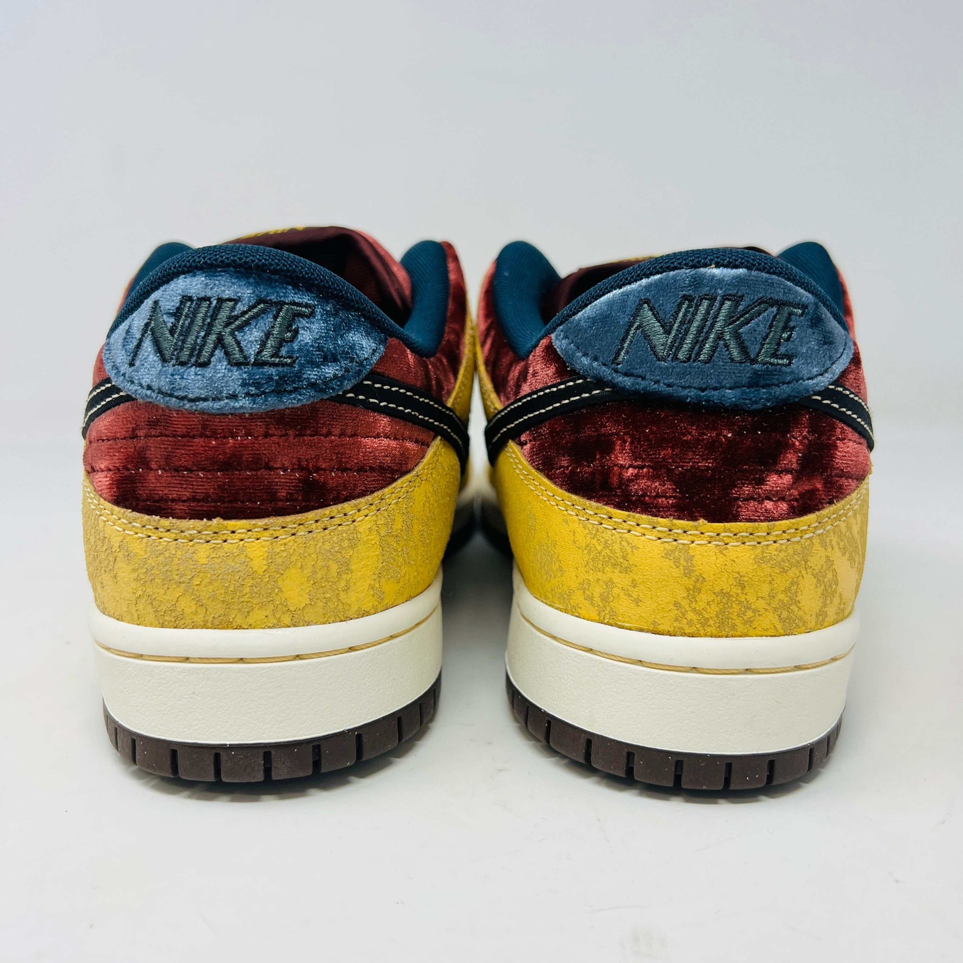 Nike SB Dunk Low City of Cinema sneakers, brand new, rear view showcasing velvet and textured design.