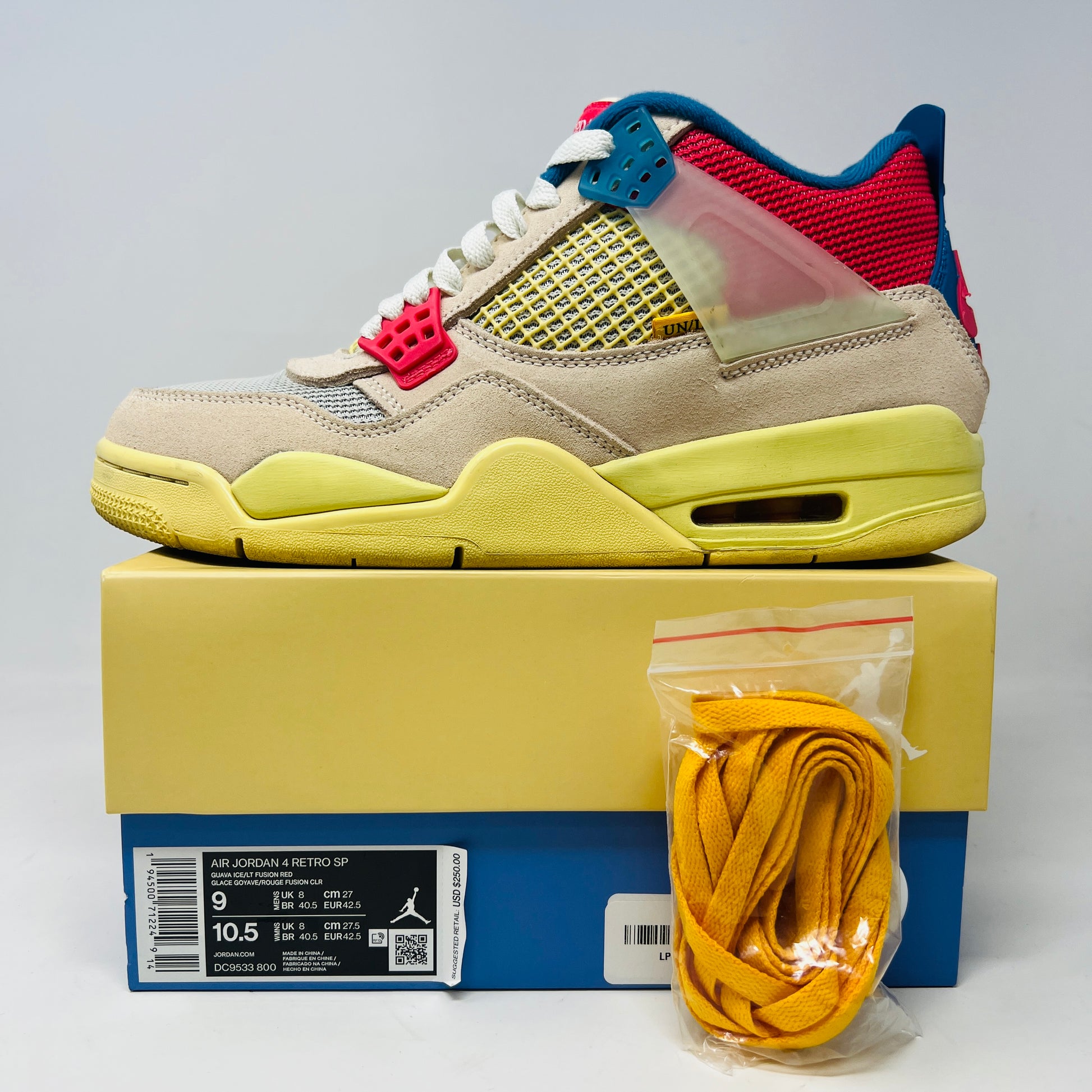 The Jordan 4 Retro Union Guava Ice sneaker from Jordan features a vibrant mix of beige, yellow, blue, and red on its clean uppers. It includes extra yellow laces packaged in a plastic bag alongside the shoe box.