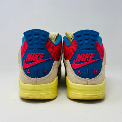 The Jordan 4 Retro Union Guava Ice sneaker from Jordan features a vibrant mix of beige, yellow, blue, and red on its clean uppers. It includes extra yellow laces packaged in a plastic bag alongside the shoe box.
