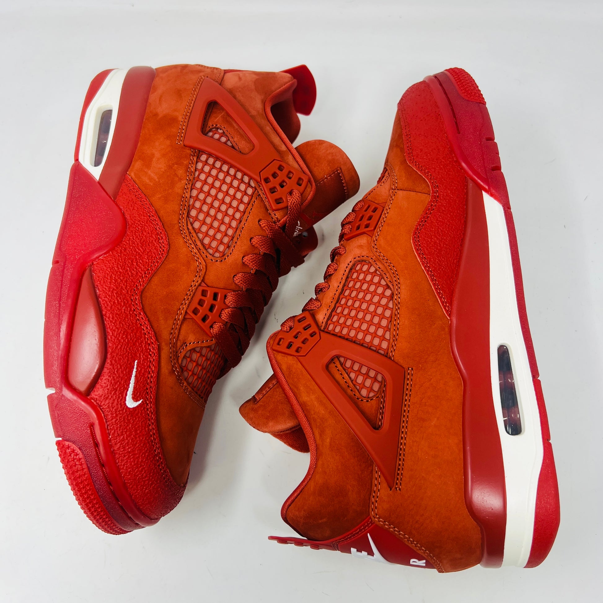 Air Jordan 4 Retro OG SP Nigel Sylvester Brick by Brick sneaker with extra laces and Velcro straps on a textured box.