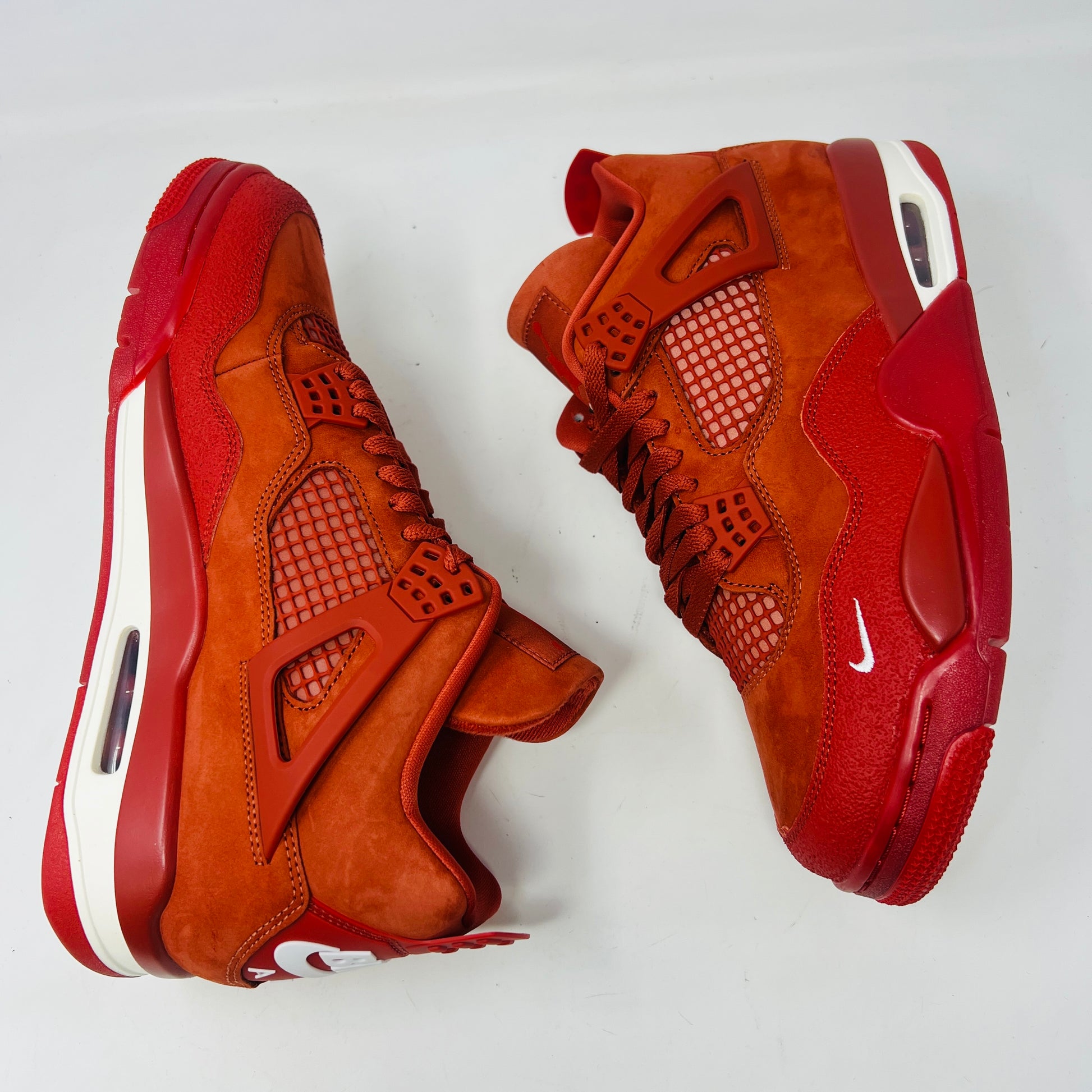 Air Jordan 4 Retro OG SP Nigel Sylvester Brick by Brick sneaker with extra laces and Velcro straps on a textured box.