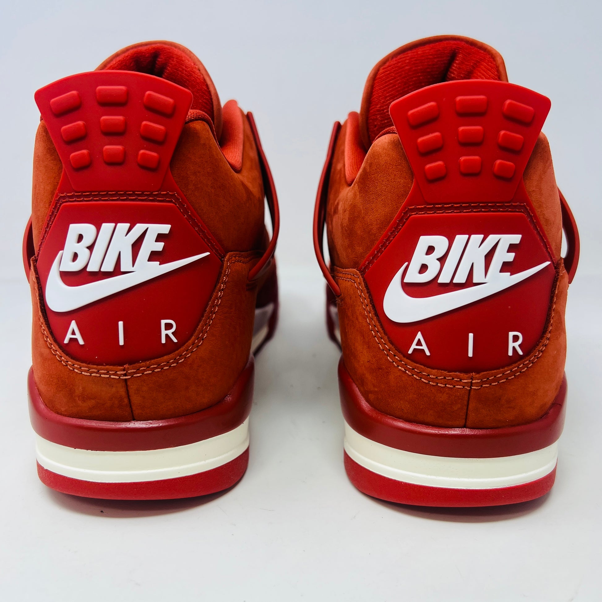 Air Jordan 4 Retro OG SP Nigel Sylvester Brick by Brick sneaker with extra laces and Velcro straps on a textured box.