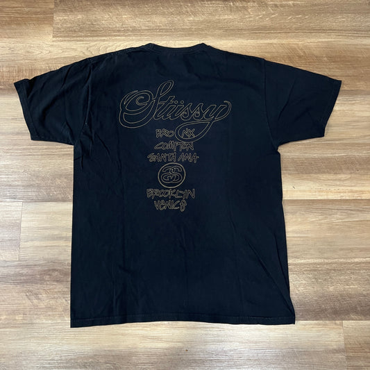 Stüssy World Tour T-shirt black with gold/tan