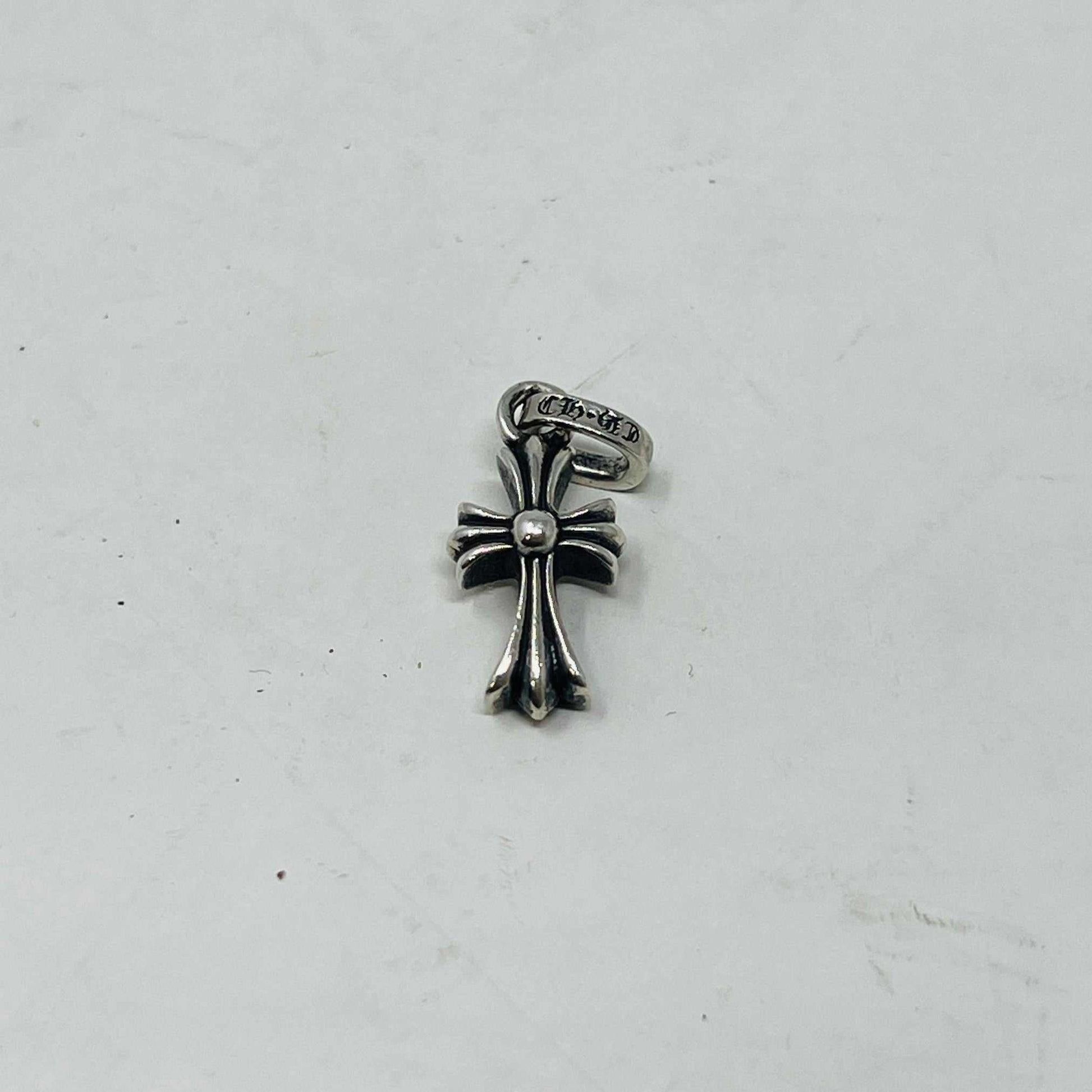 Preowned Chrome Hearts Baby Fat Cross silver pendant on white background