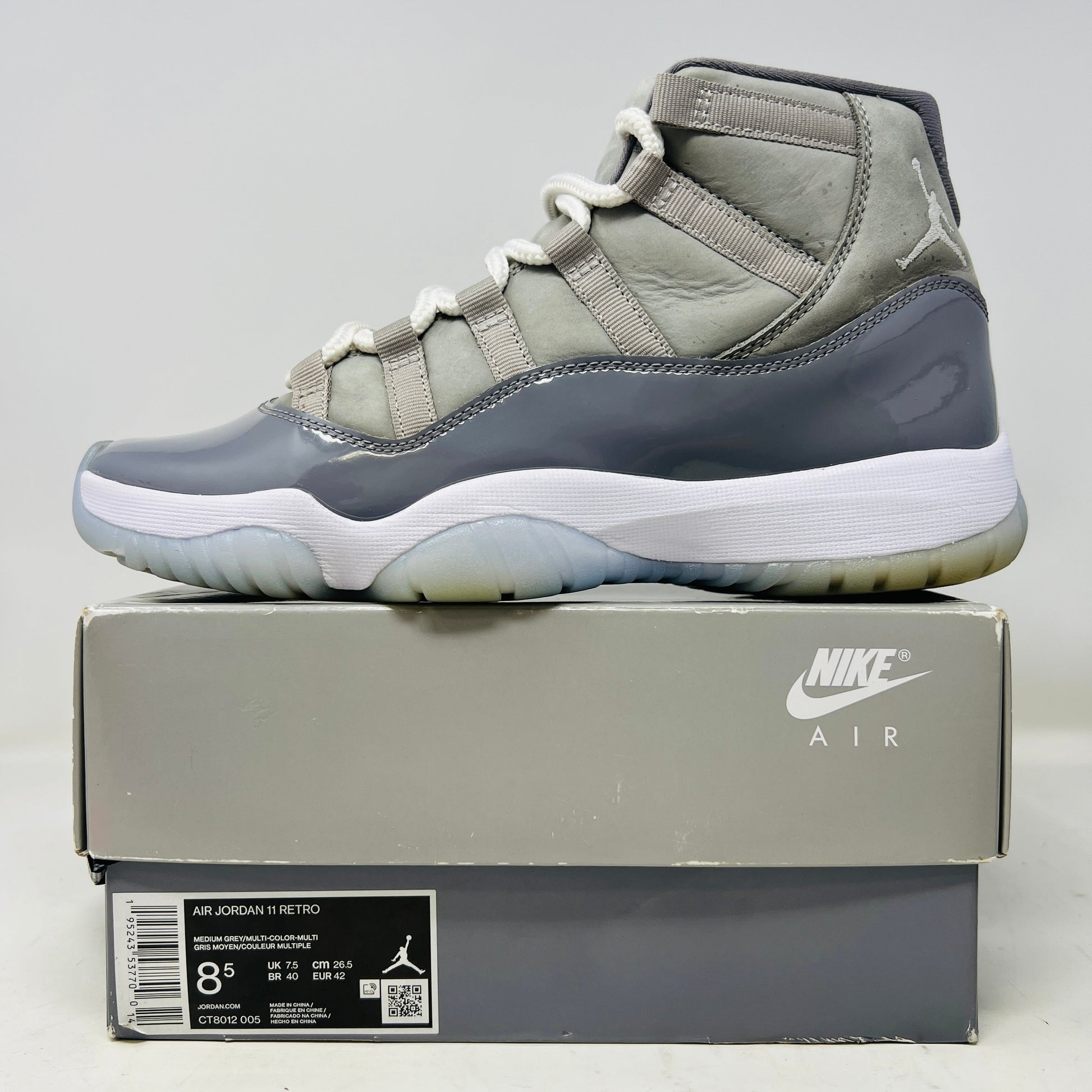 Jordan 11 Retro Cool Grey 2021 sneaker with clean upper and slight yellowing, displayed on original box.