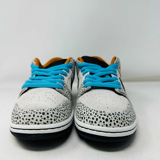 The Nike SB Dunk Low Electric Pack Olympic Safari, a new 2024 release, showcases a speckled gray and white design with a black swoosh, blue laces, and orange lining, elegantly set upon its box against a plain backdrop.