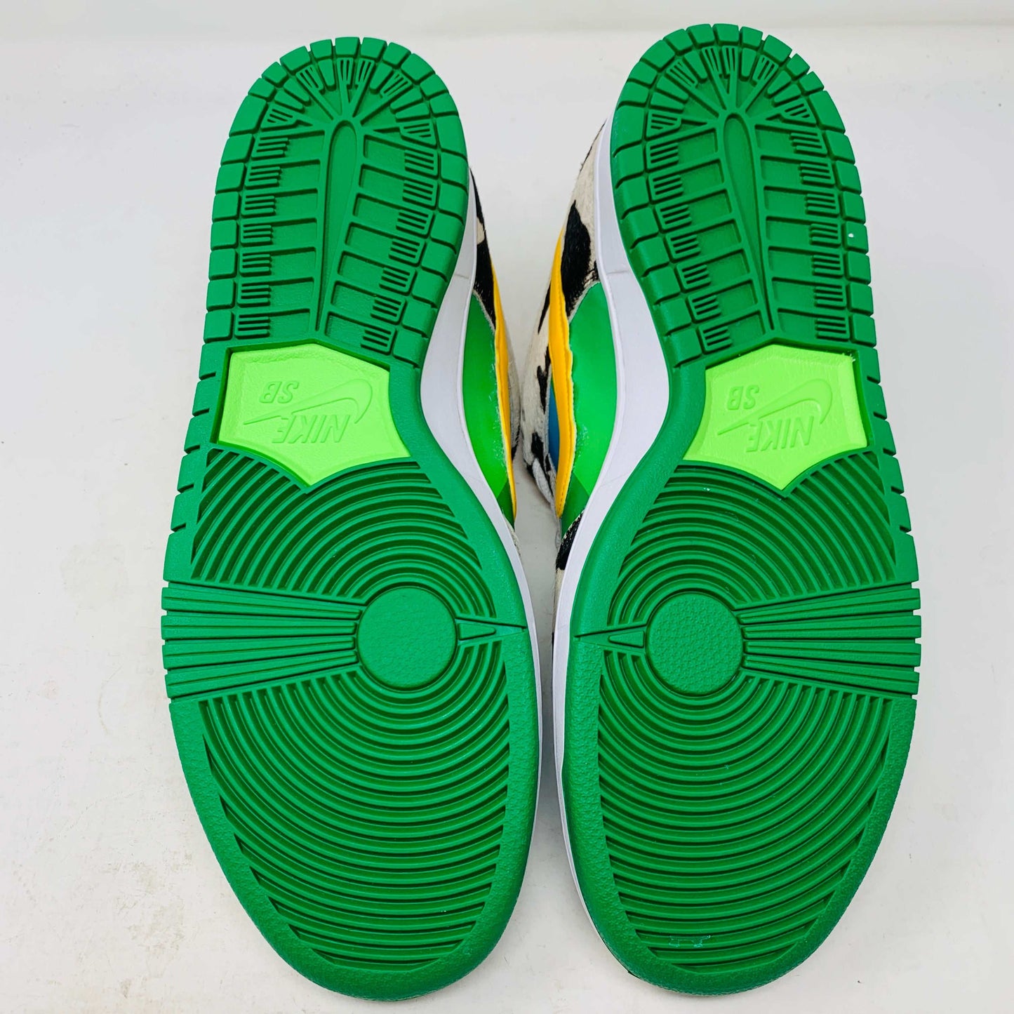 Introducing the new Nike SB Dunk Low Chunky Dunky with a vibrant cow print, featuring blue, green, and yellow sections. This 100% authentic sneaker includes a yellow swoosh and comes in a matching green and yellow box with extra laces, all from Nike.
