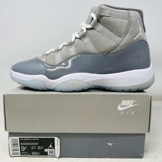 Jordan 11 Retro Cool Grey 2021 sneaker on Nike Air box with clean uppers and grey patent leather detailing